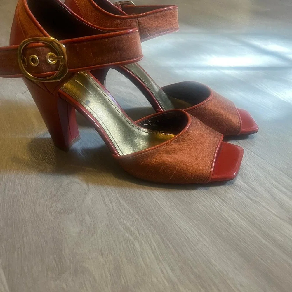 Paleo orange leather heels with gold buckle